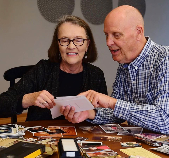 grandparents sorting photos